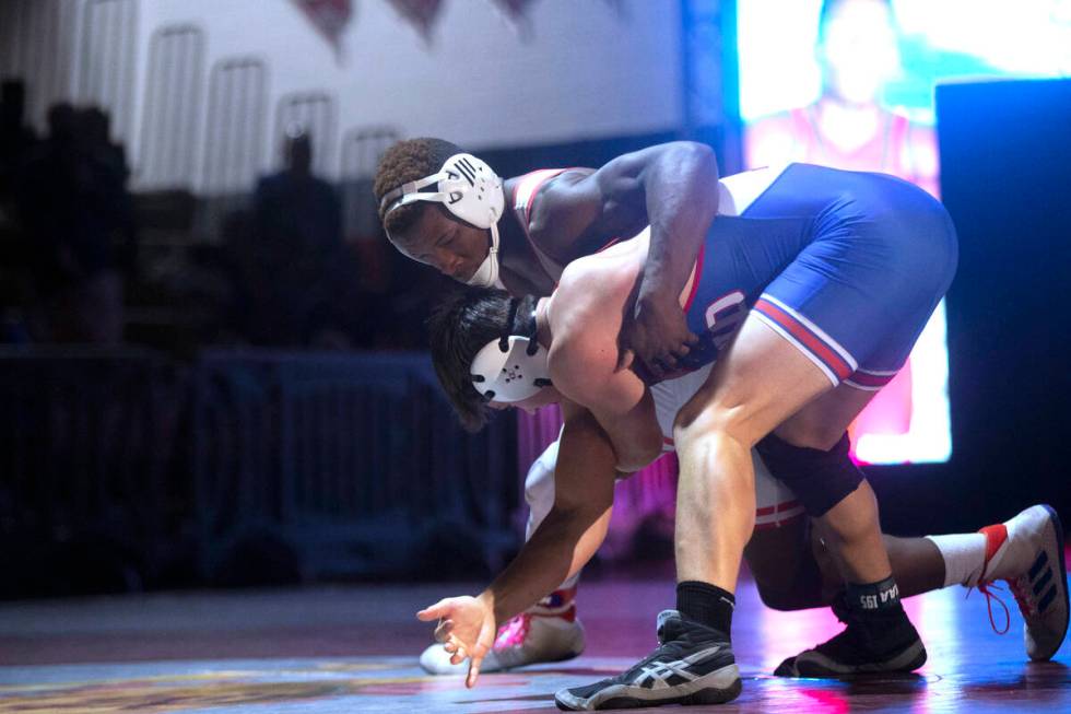 Liberty High School’s Melvin Whitehead, top, wrestles Reno High School’s Adam Cla ...