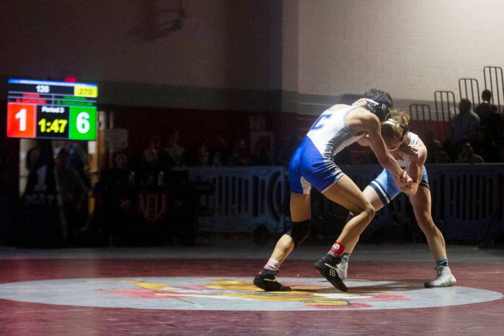 Centennial High School’s Dylann Ciarciaglini, left, wrestles Carson High School’s ...