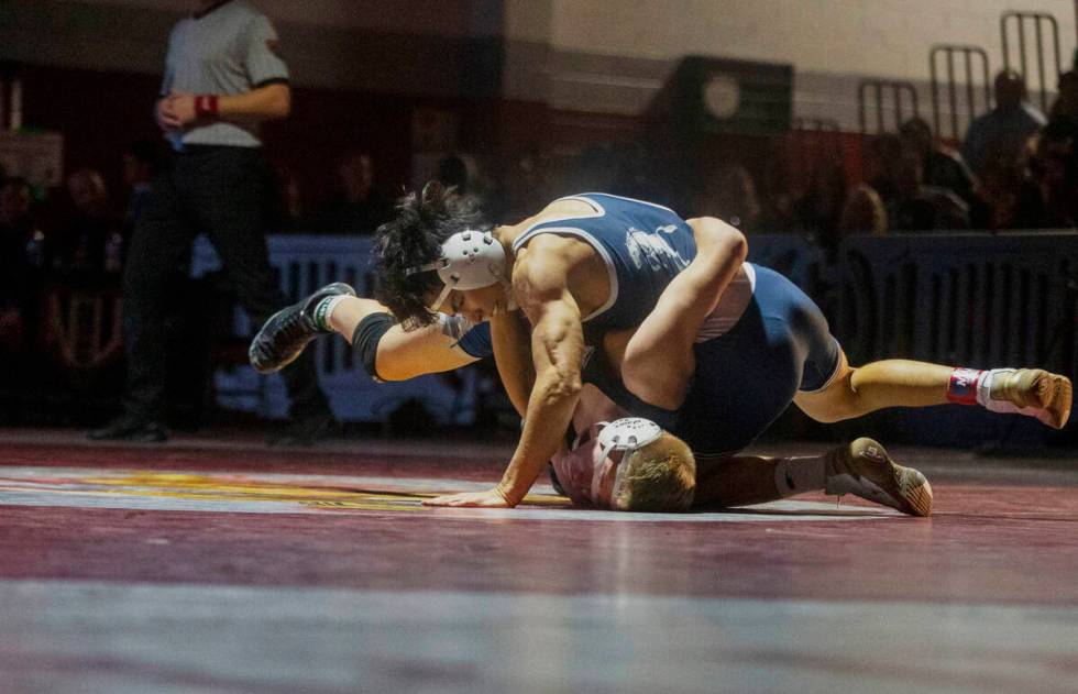 Shadow Ridge High School’s Trent Smith takes control over McQueen High School’s P ...