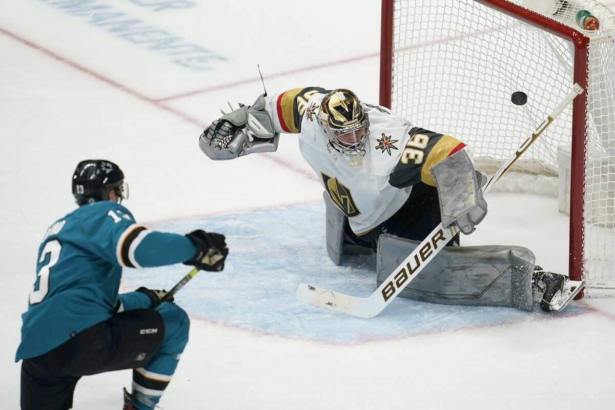 San Jose Sharks center Nick Bonino, left, scores a goal against Vegas Golden Knights goaltender ...