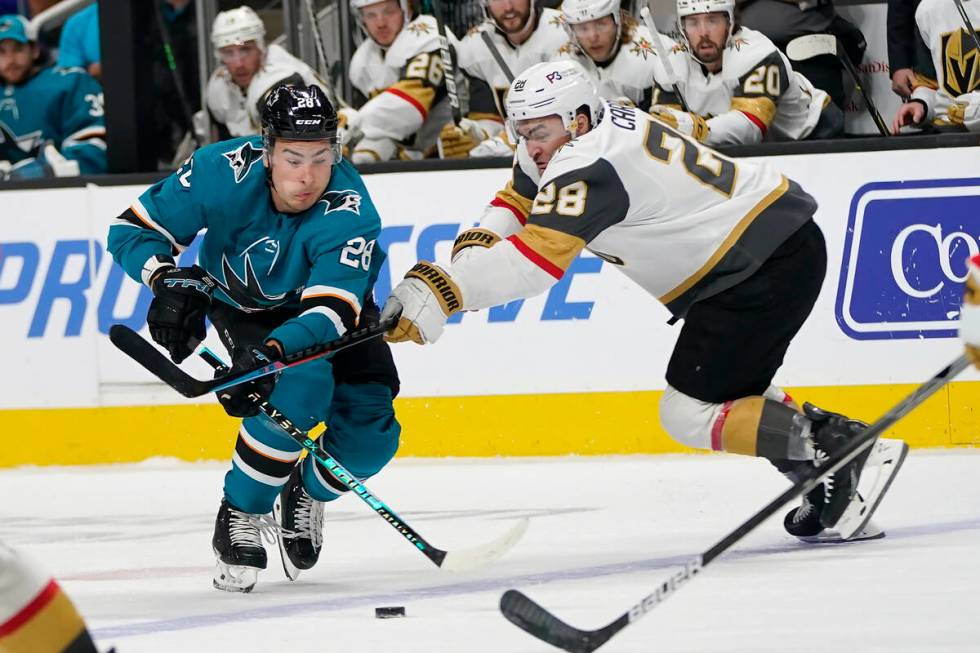 San Jose Sharks right wing Timo Meier, left, skates with the puck against Vegas Golden Knights ...