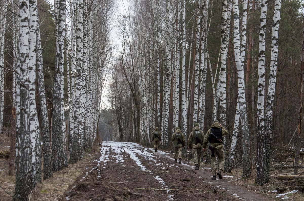 Ukrainian border guard officers patrol the Ukrainian-Belarusian state border at a checkpoint in ...