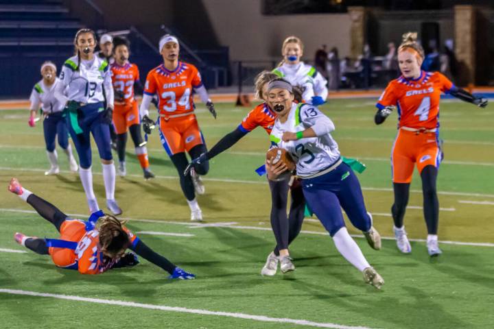 Green Valley's Soriah Tafua avoids Bishop Gorman defenders in a 31-13 Class 5A state semifinal ...