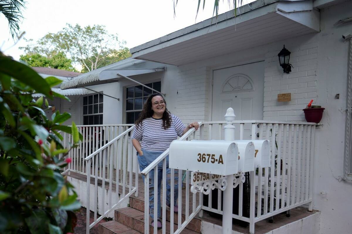 Krystal Guerra, 32, poses for a picture outside her apartment, which she has to leave after her ...