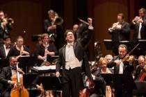 Music Director Donato Cabrera salutes the audience before the start of a performance by the Las ...