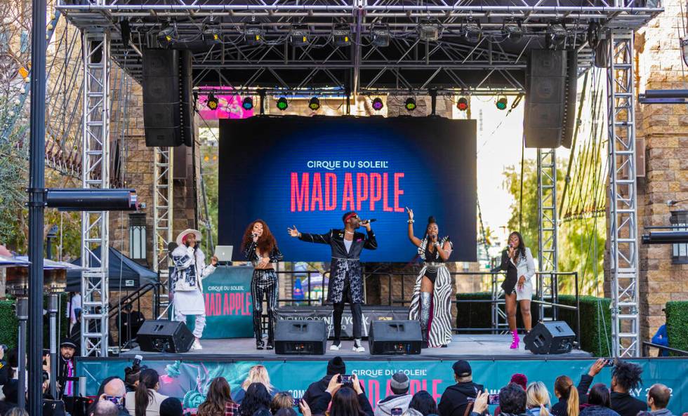 Singers in the new Cirque du Soleil show "Mad Apple" perform outside New York-New York during a ...