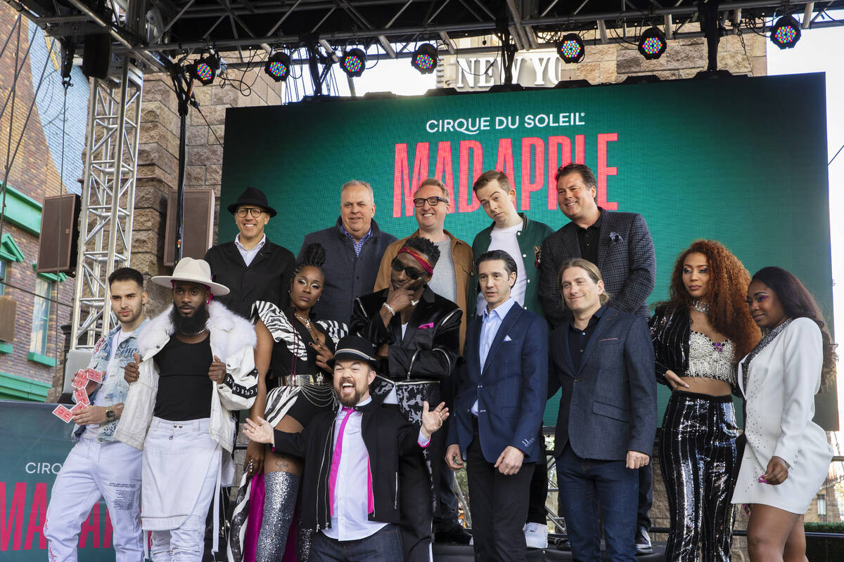 Members of the cast of the new Cirque du Soleil show "Mad Apple" pose for photos outside New Yo ...