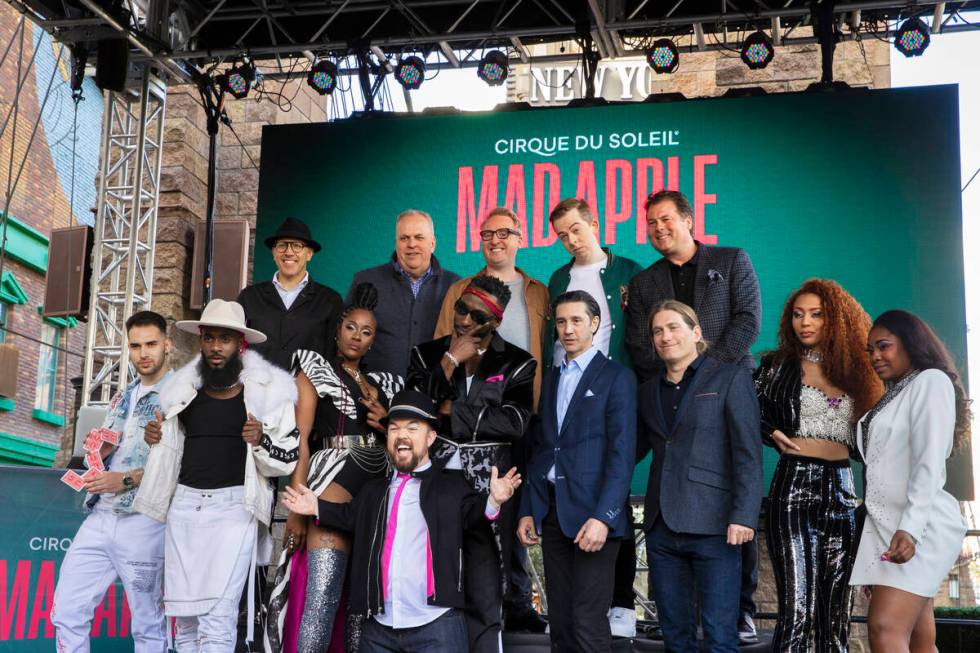 Members of the cast of the new Cirque du Soleil show "Mad Apple" pose for photos outside New Yo ...