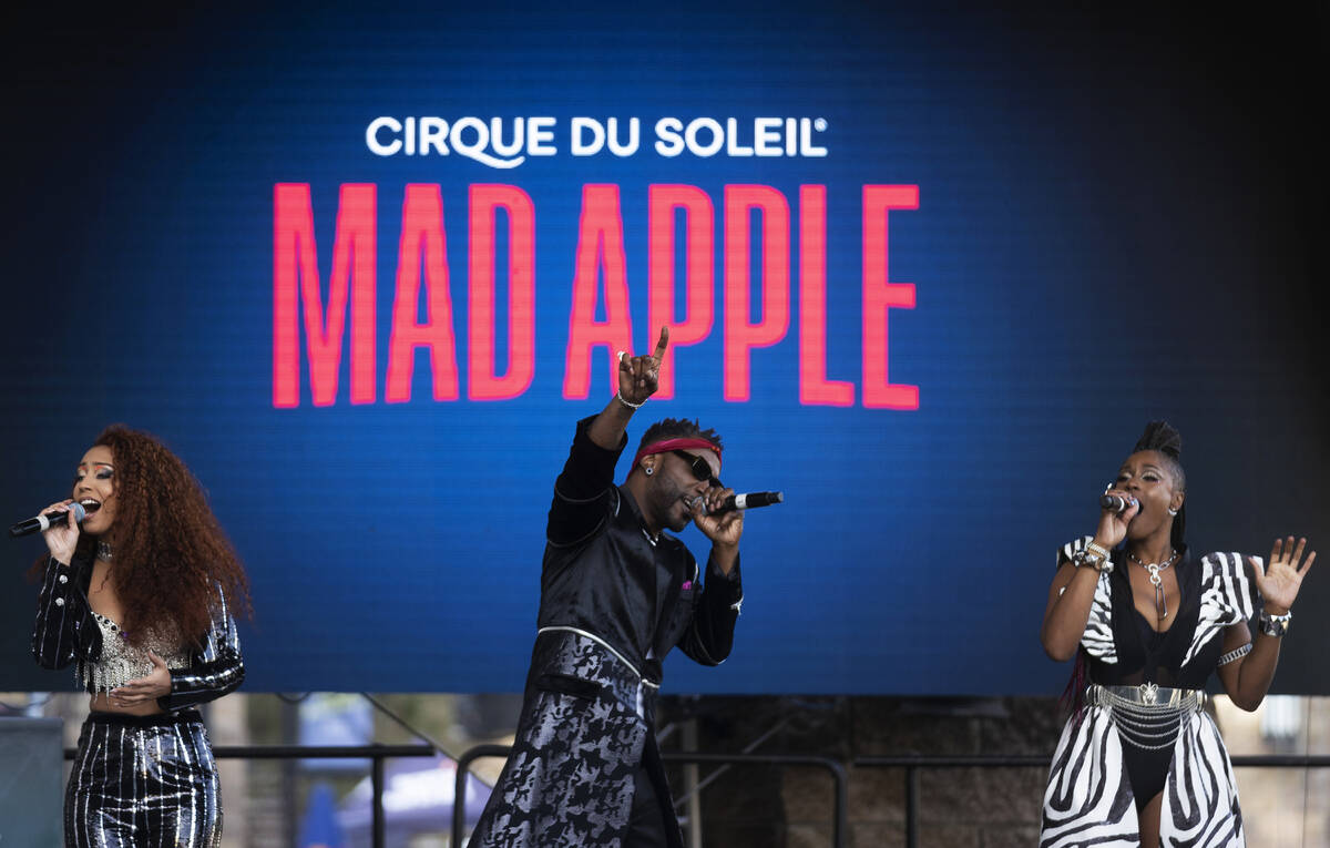 Singers in the new Cirque du Soleil show "Mad Apple" perform outside New York-New York during a ...