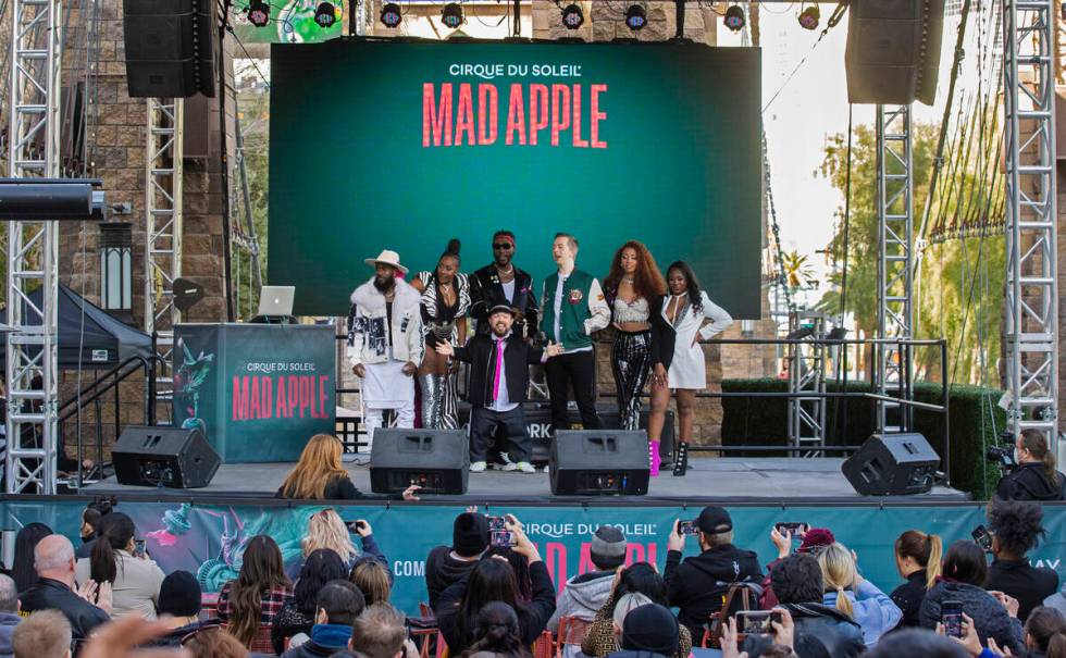 Members of the cast of the new Cirque du Soleil show "Mad Apple" pose for photos outside New Yo ...