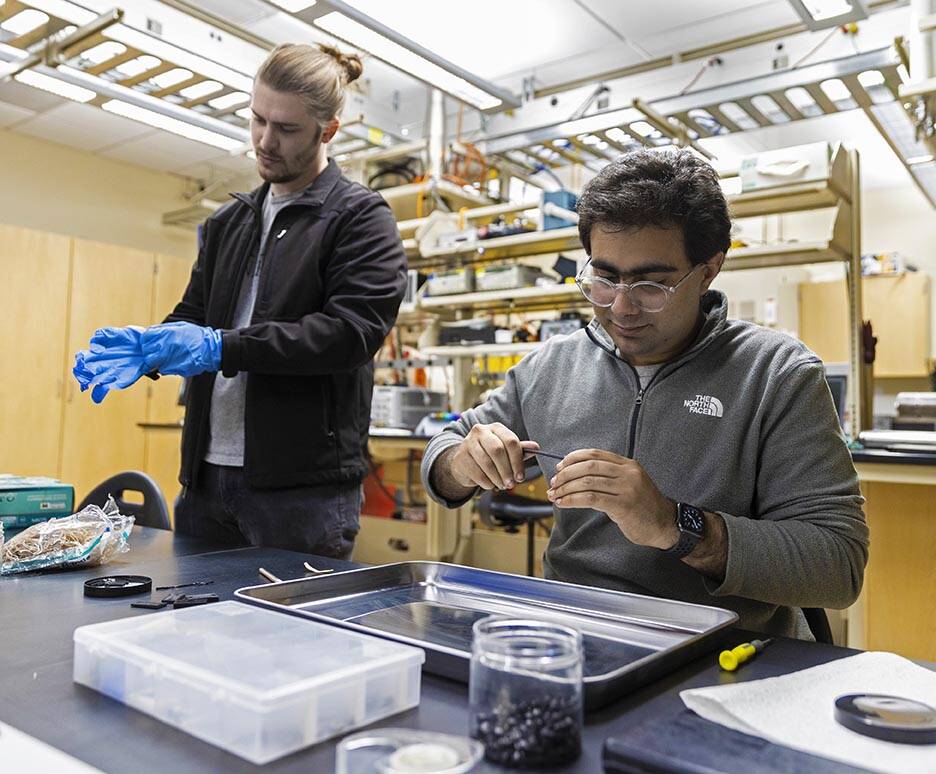 Lucas Gallup, left, and Youssef Fahmy, both graduate students studying mechanical engineering, ...