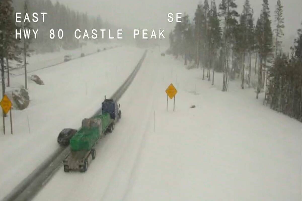 Light traffic makes its way in snowy conditions along Interstate 80 at Castle Peak, Calif., Tue ...