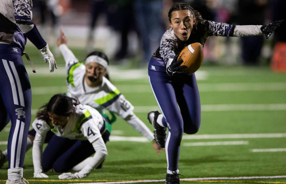 Shadow Ridge’s Makayla McEvoy (3) reaches across the goal line for a second half touchdo ...
