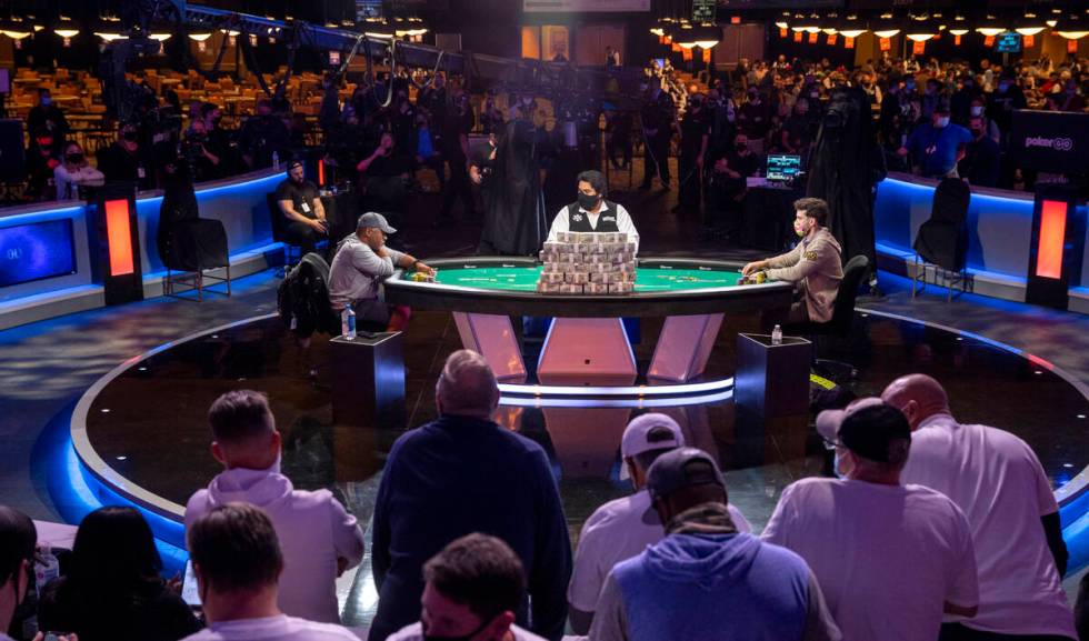 George Holmes, left, and Koray Aldemir battle at the final table for the $10,000 buy-in Main Ev ...