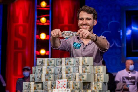 Winner Koray Aldemir with his bracelet and stacks of cash at the final table for the $10,000 bu ...