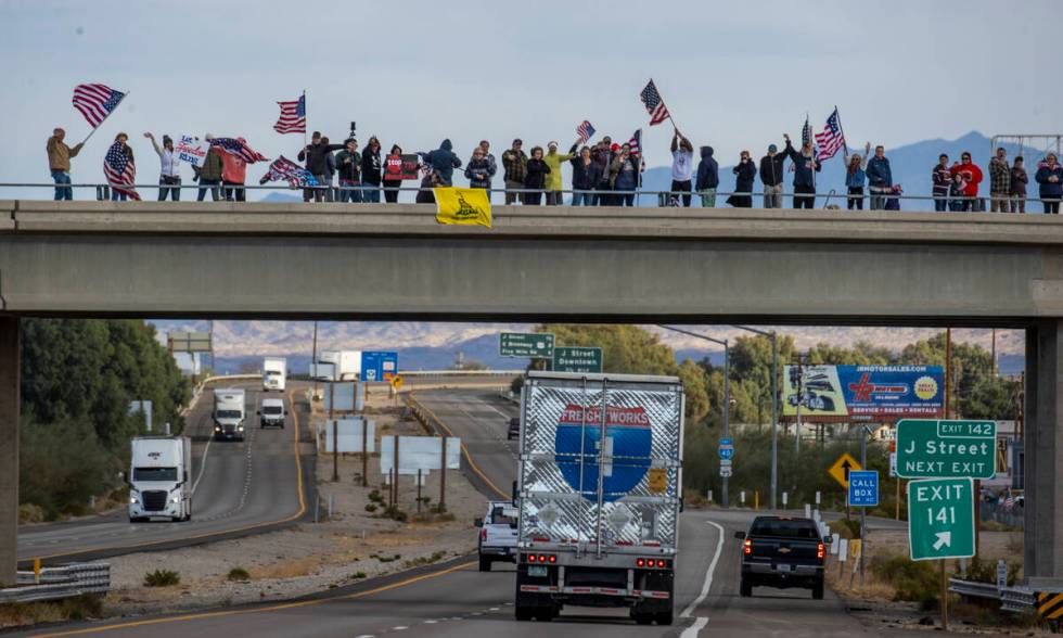 Supporters line an I-40 overpass in Needles awaiting The People’s Convoy who departed Ad ...