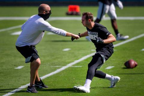 Las Vegas Raiders wide receiver Hunter Renfrow, right, works with offensive quality control coa ...