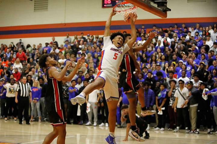 Bishop Gorman High School's Darrion Williams (5) dunks against Liberty High School's Aaron Pric ...