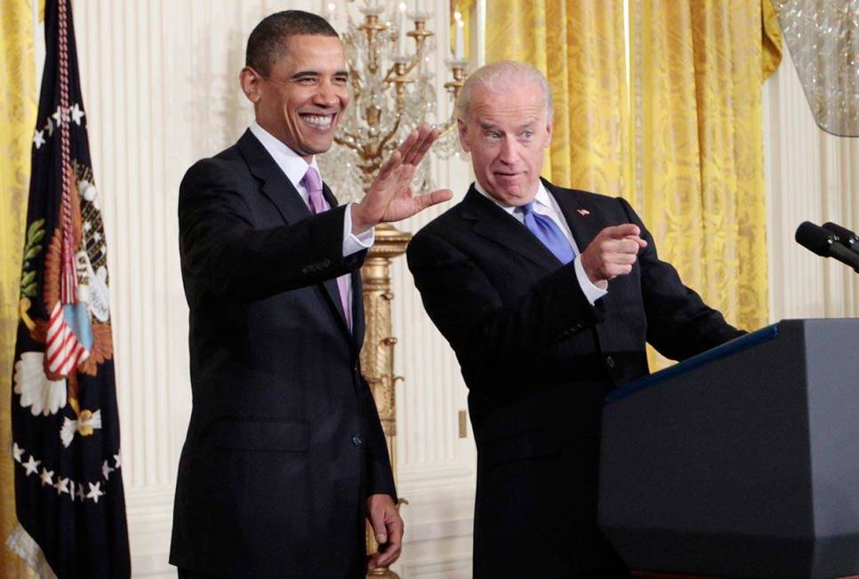 In a Jan. 21, 2010, file photo President Barack Obama and Vice President Joe Biden acknowledge ...