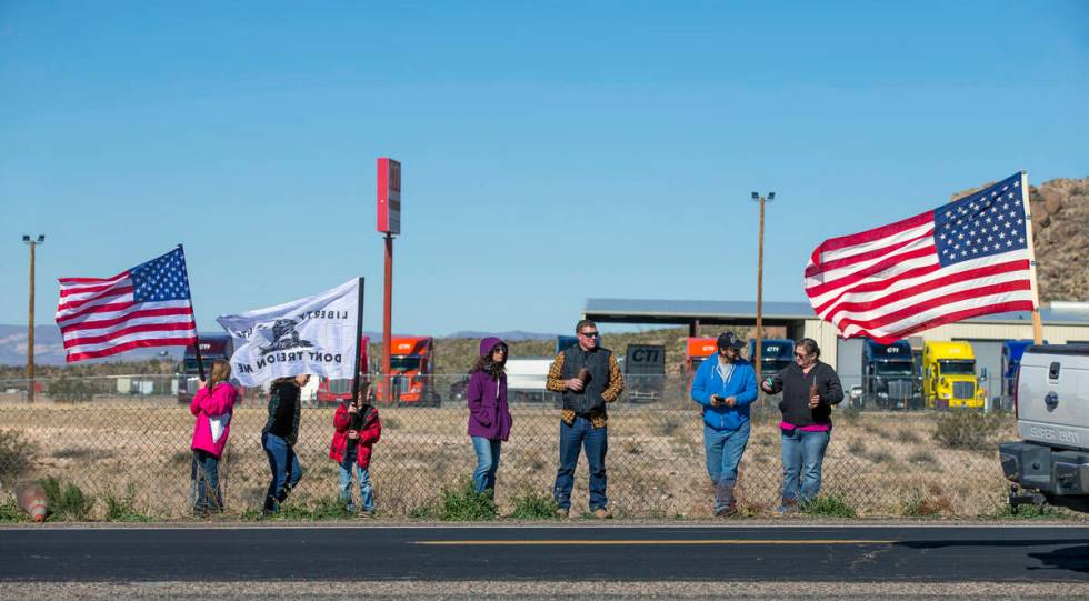 Supporters cheer on The People’s Convoy as they arrive at Crazy Fred’s Truck Stop ...