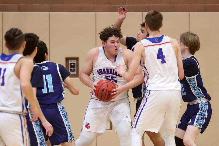 Green Valley Christian center Joshua Valencia (55) moves the ball against Adelson’s Juda ...