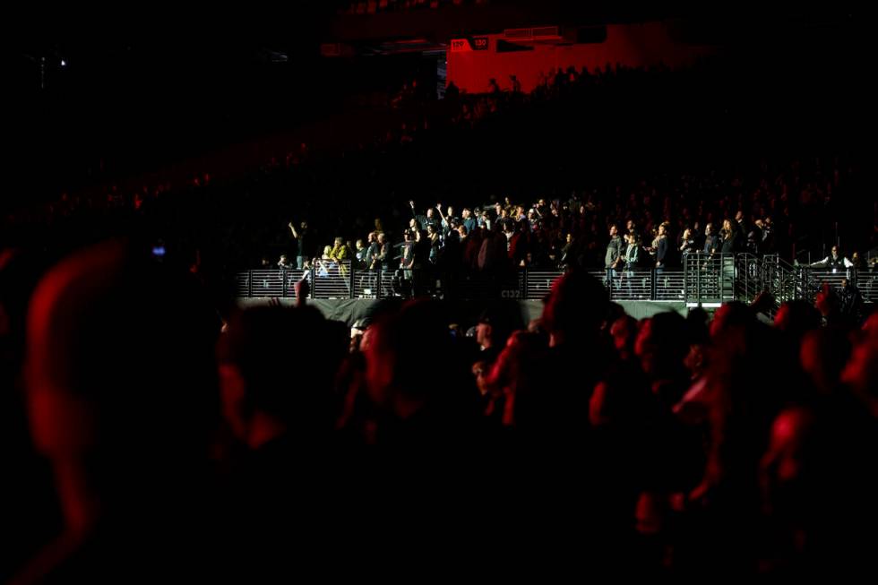 Fans watch Metallica perform in a music concert at Allegiant Stadium in Las Vegas, Friday, Feb. ...