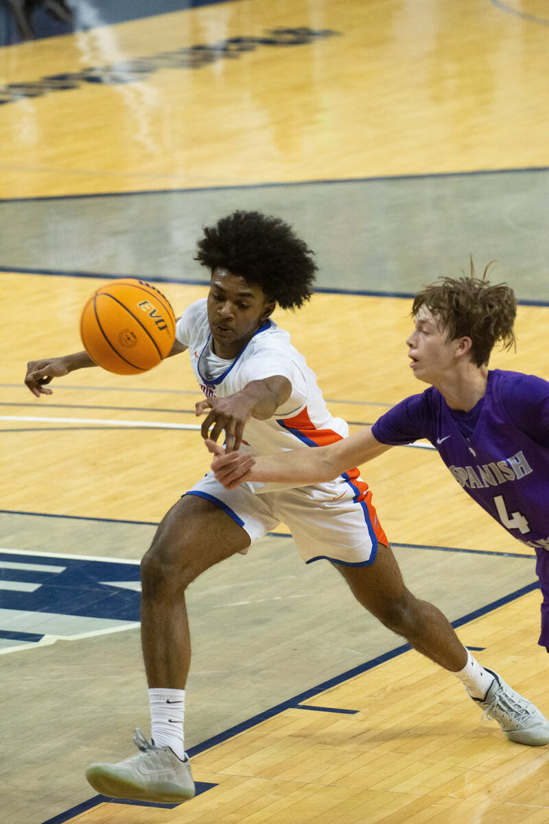 Bishop Gorman's Keenan Bey goes after a loose ball against Spanish Springs High School during t ...