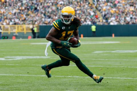Green Bay Packers wide receiver Davante Adams (17) runs the ball after a catch against the Wash ...