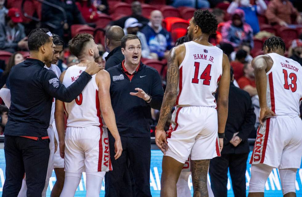 UNLV Rebels head coach Kevin Kruger instructs his players in a timeout late versus San Jose Sta ...