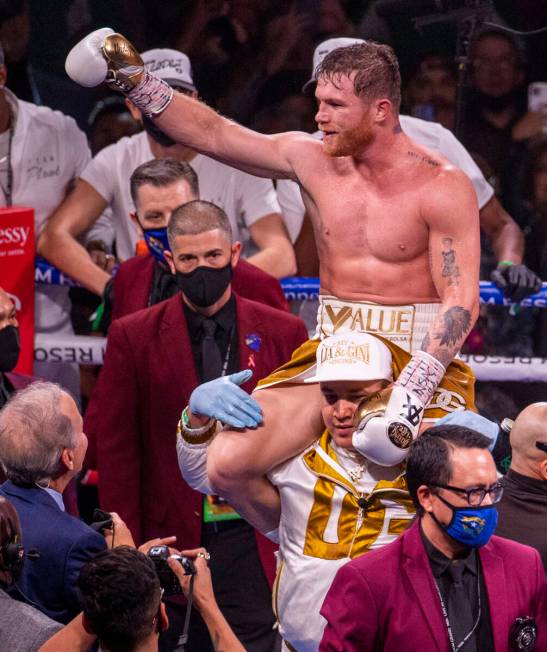 Saul "Canelo" Alvarez celebrates his win over Caleb Plant in the 11th round victory f ...