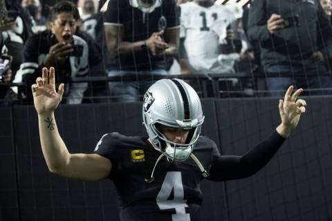 Raiders quarterback Derek Carr (4) is introduced before the start of an NFL football game again ...