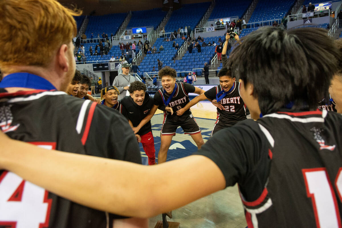 Liberty High School celebrates its win over Bishop Gorman in the NIAA Class 5A boys basketball ...