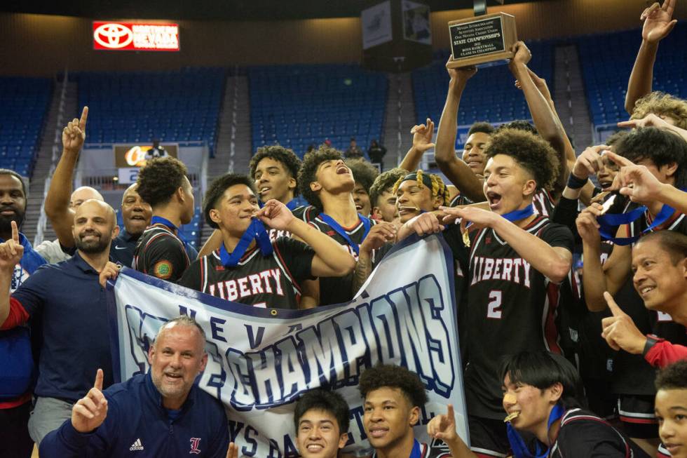 Liberty High School celebrates its win over Bishop Gorman in the NIAA Class 5A boys basketball ...