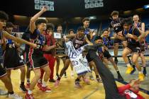 Liberty High School celebrates its win over Bishop Gorman in the NIAA Class 5A boys basketball ...