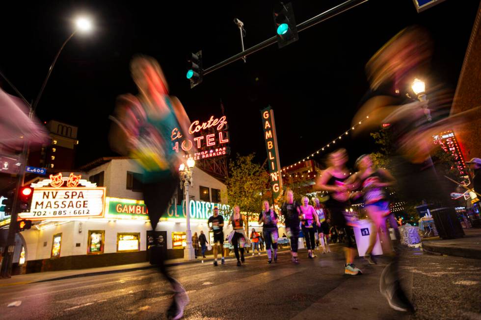 Participants run past the El Cortez during the Rock ‘n’ Roll Las Vegas half marat ...