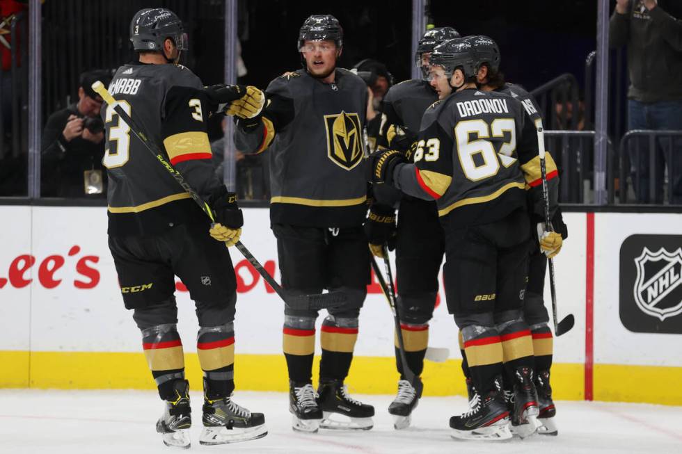 Vegas Golden Knights center Chandler Stephenson (20) celebrates a goal with his team during the ...