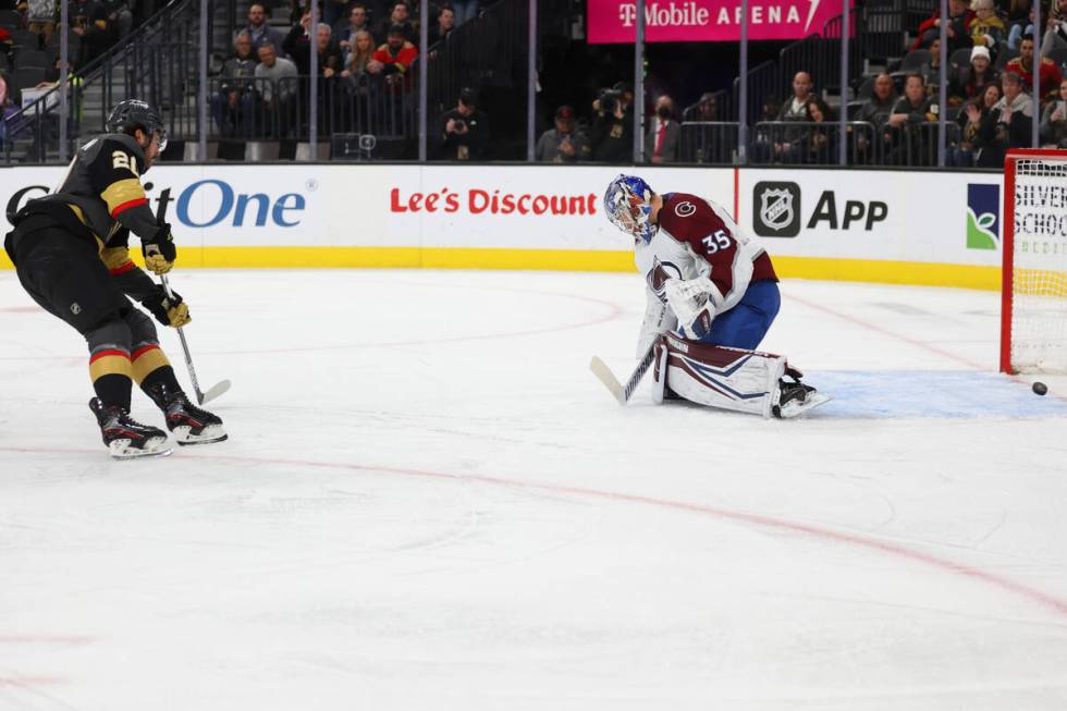 Vegas Golden Knights center Chandler Stephenson (20) takes a shot for a score against Colorado ...