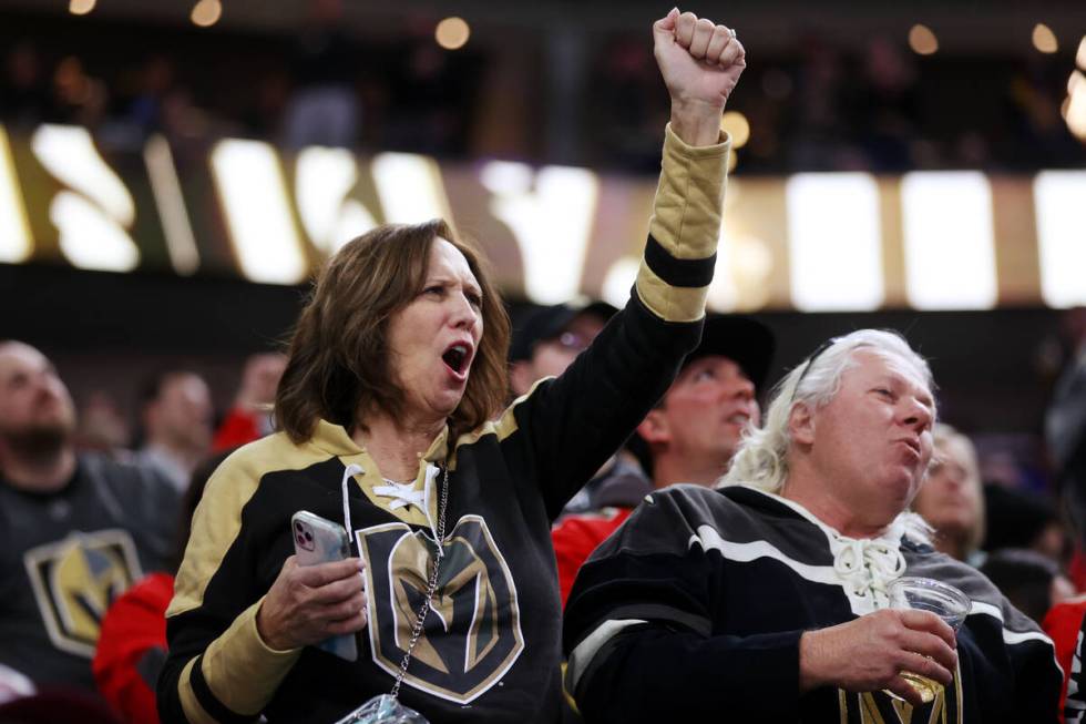 Fans celebrate a score by the Vegas Golden Knights against the Colorado Avalanche during the fi ...