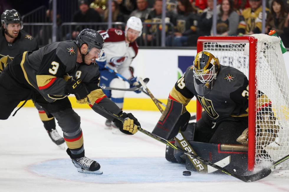 Vegas Golden Knights goaltender Laurent Brossoit (39) with defenseman Brayden McNabb (3) makes ...