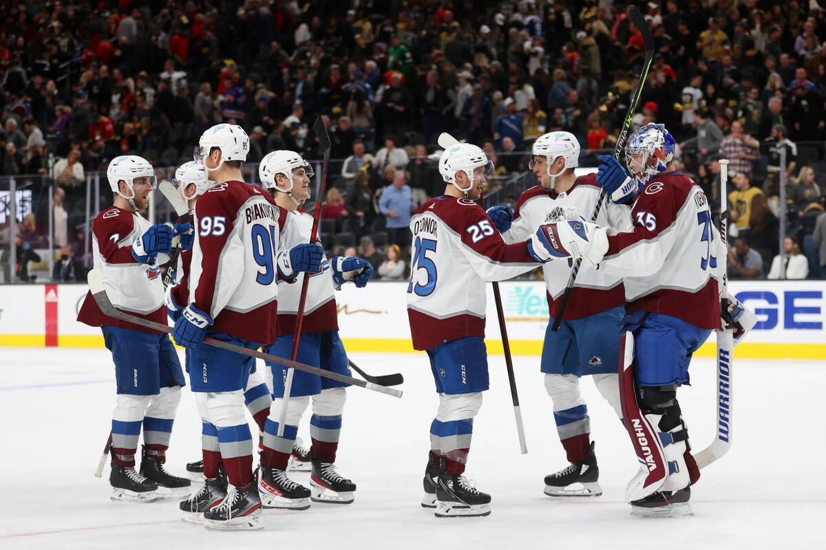 The Colorado Avalanche celebrate a win against the Vegas Golden Knights in an NHL hockey game a ...