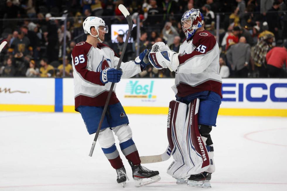 Colorado Avalanche left wing Andre Burakovsky (95) and goaltender Darcy Kuemper (35) celebrate ...