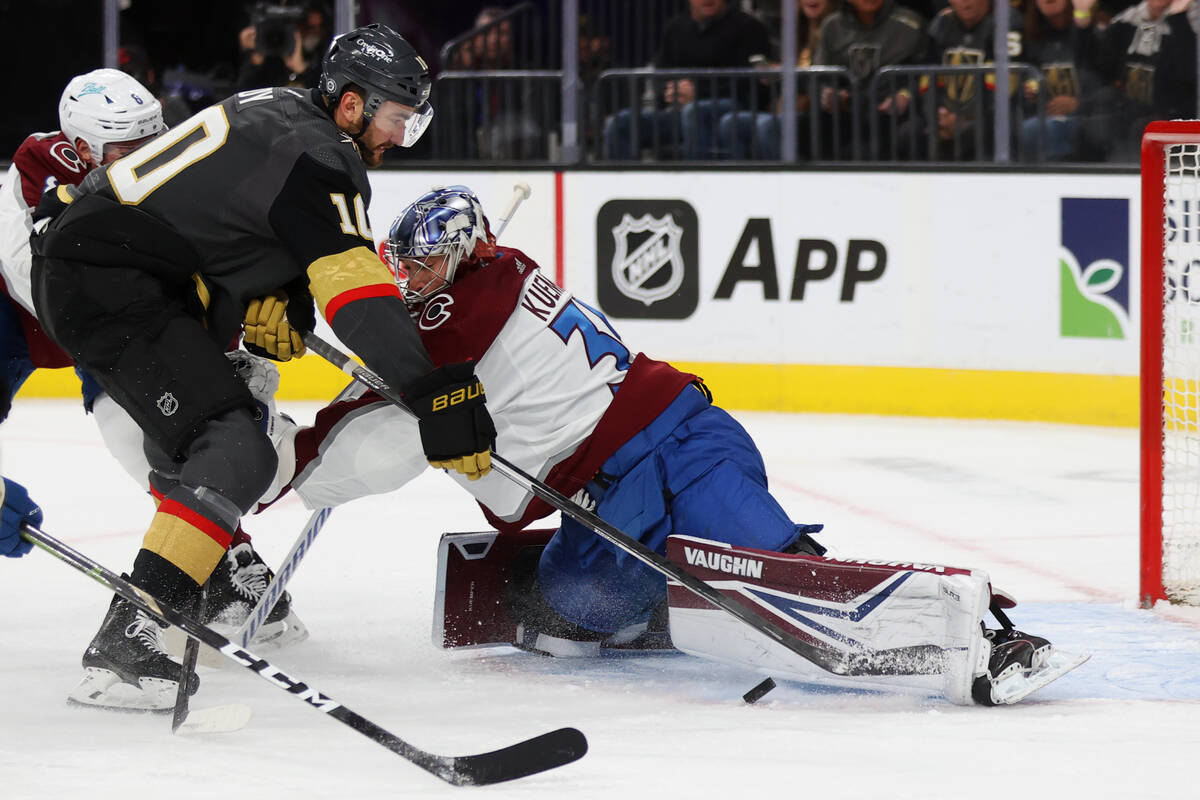 Colorado Avalanche goaltender Darcy Kuemper (35) defends a shot by Vegas Golden Knights center ...