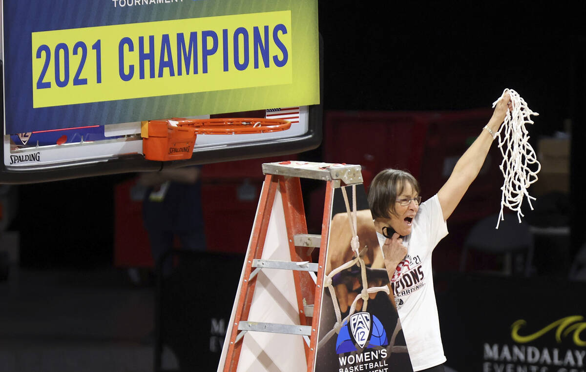 Stanford head coach Tara VanDerveer waves the net after defeating UCLA in an NCAA college baske ...