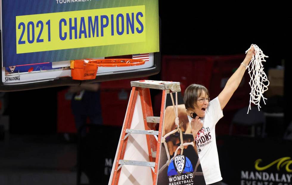 Stanford head coach Tara VanDerveer waves the net after defeating UCLA in an NCAA college baske ...