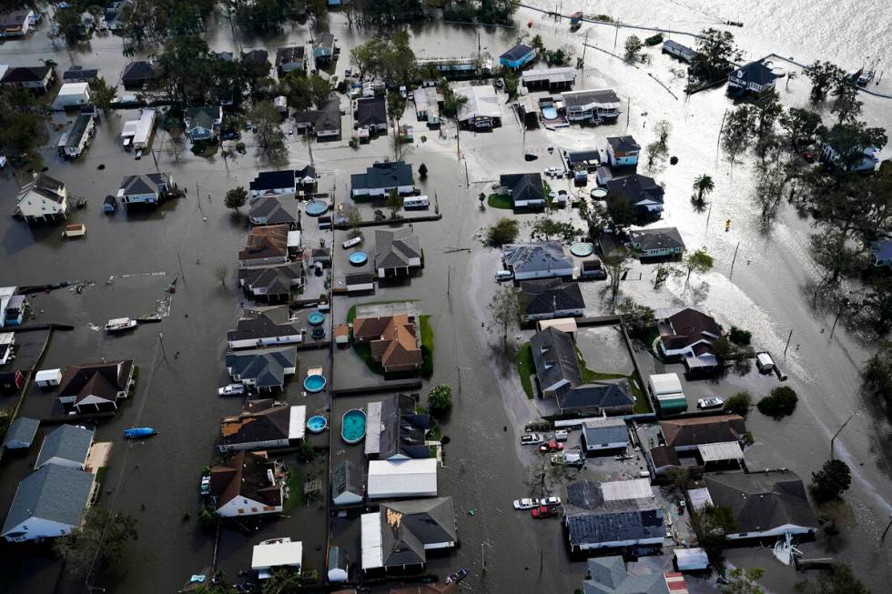 Homes are flooded in the aftermath of Hurricane Ida, Monday, Aug. 30, 2021, in Jean Lafitte, La ...