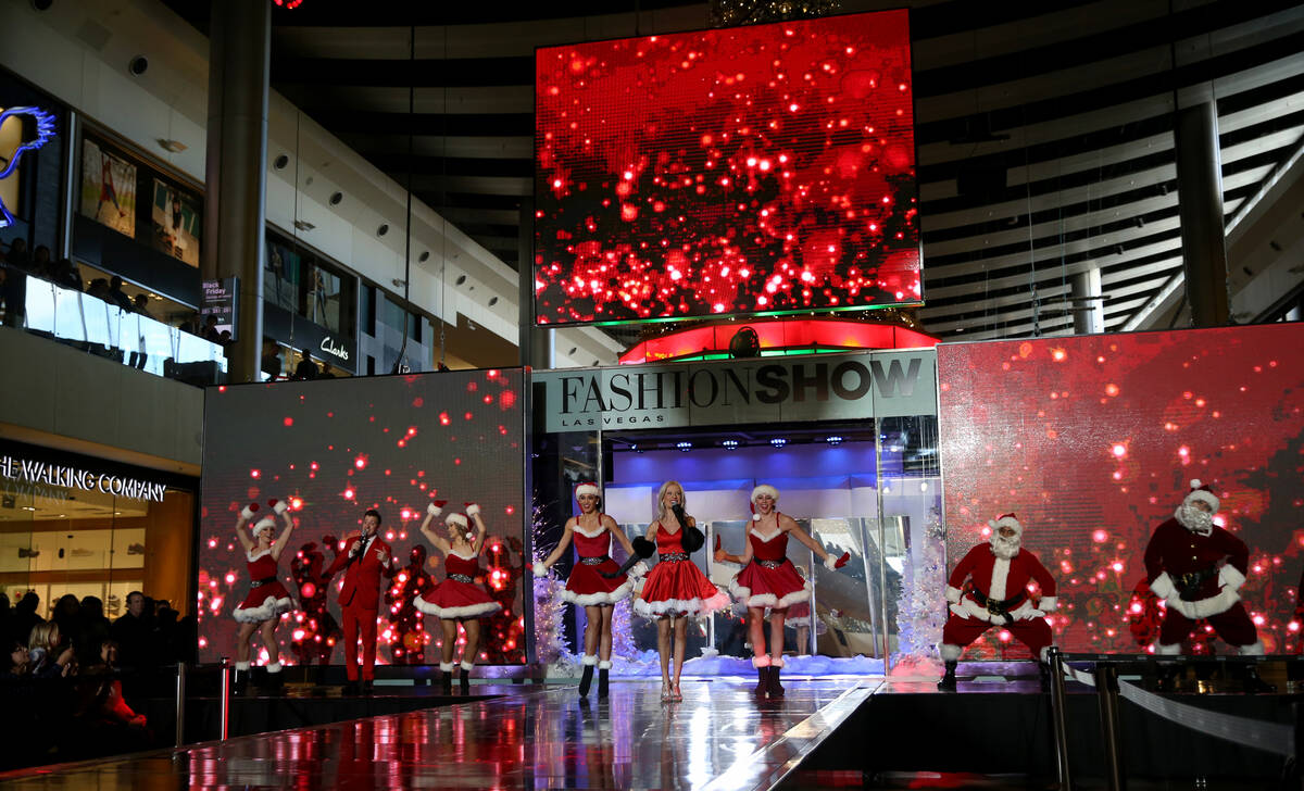 Performers in the Holiday Glow at Fashion Show mall in Las Vegas Friday, Nov. 29, 2019. A pensi ...