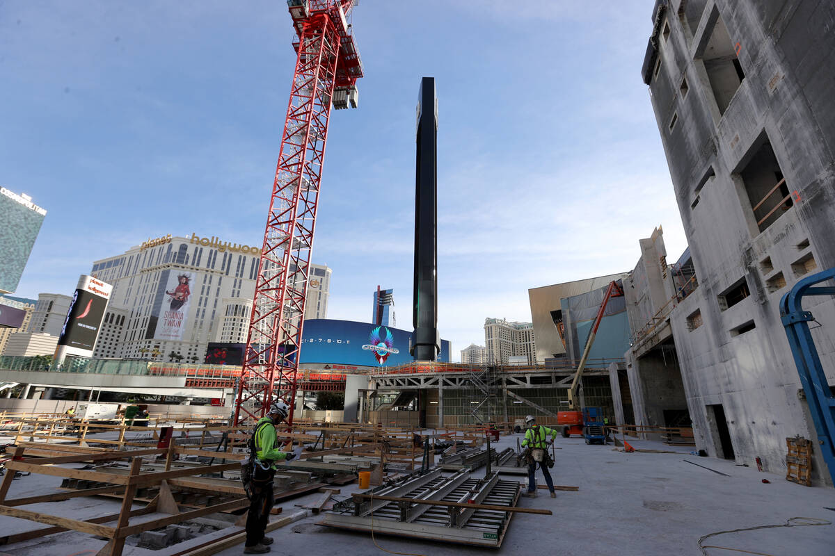 Construction continues on Project63, a four-story retail complex on the former Harmon hotel sit ...