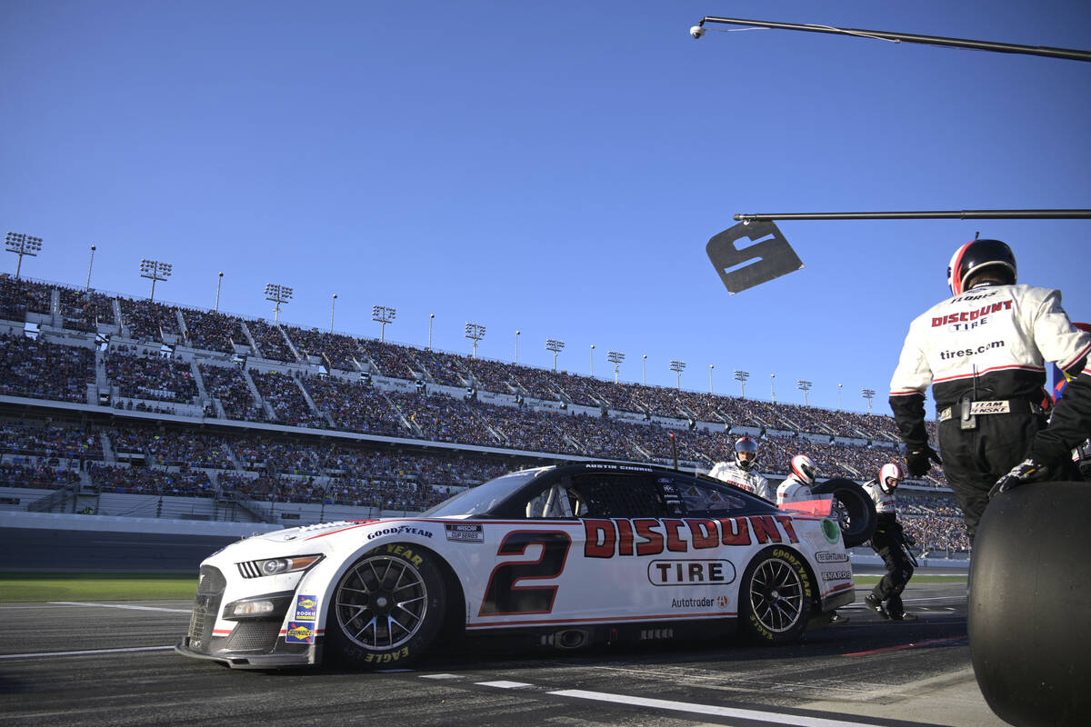 Austin Cindric makes a pit stop during the NASCAR Daytona 500 auto race at Daytona Internationa ...