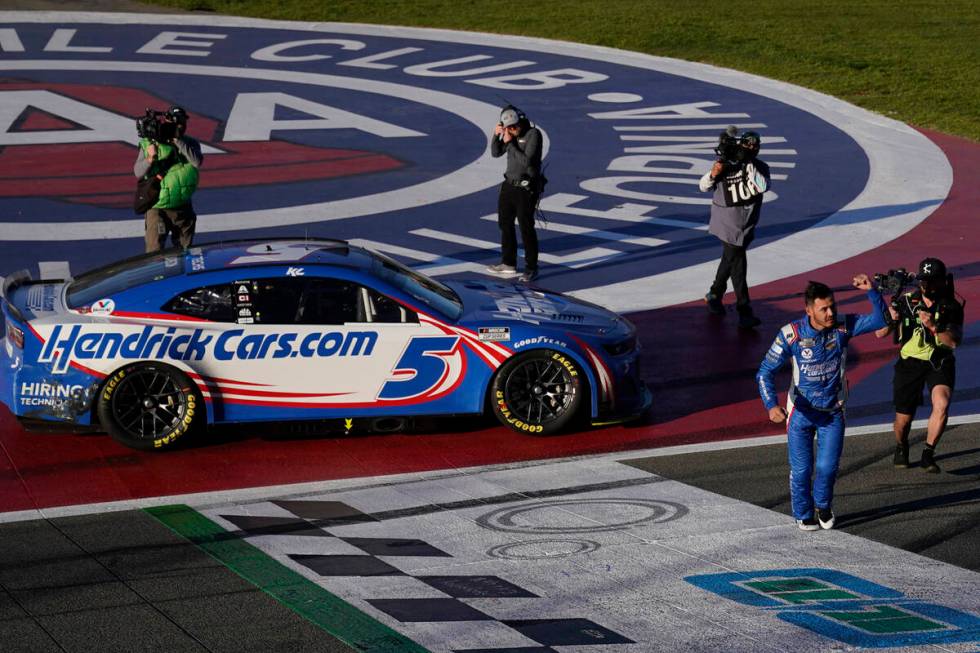 Kyle Larson, front right, celebrates after winning a NASCAR Cup Series auto race at Auto Club S ...