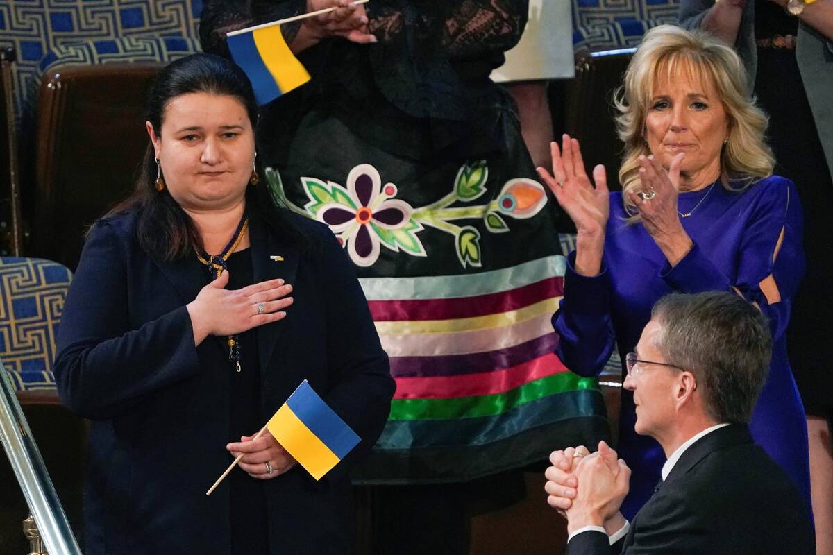 Ukraine Ambassador to the United States, Oksana Markarova, acknowledges President Joe Biden as ...